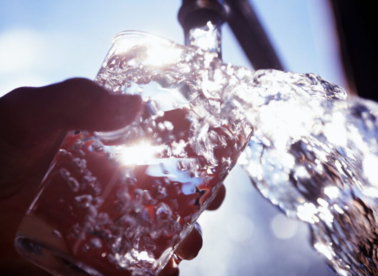 Wisconsin Vacation Spot Under ‘Do Not Drink’ Water Advisory filling glass with water